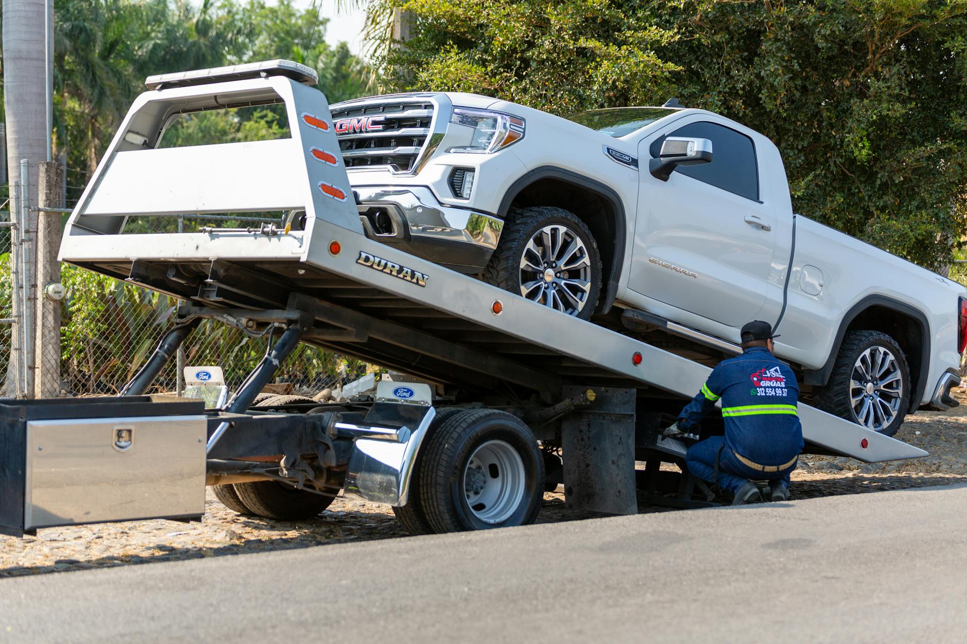 A close-up of a tow truck's secure wheel-lift system ready to safely transport a vehicle in Canton.